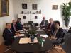 A three-member Curia delegation, led by the President of the Curia of Hungary and a three-member Dutch Supreme Court delegation, led by the President of the Supreme Court of the Netherlands engaged in a discussion around a meeting table in the premises of
